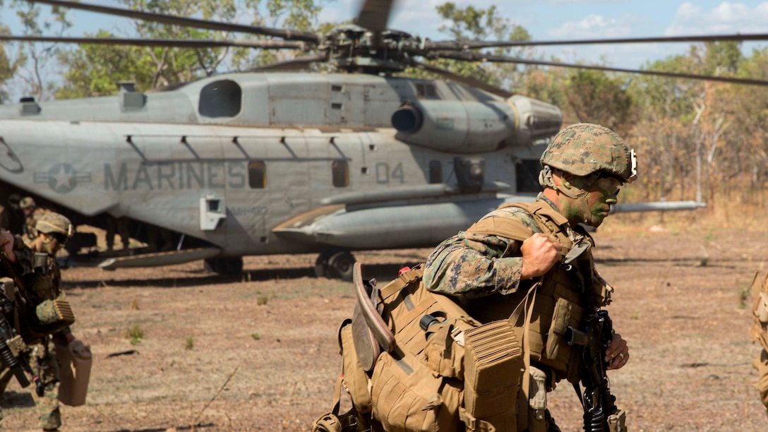A U.S. Marine with Company A, 1st Battalion, 4th Marine Regiment, Marine Rotational Force – Darwin, exits the landing zone May 22 at Mount Bundey Training Area, Northern Territory, Australia. Two CH-53E Super Stallion helicopters picked up and transported approximately 140 Marines from Robertson Barracks to MBTA to begin Exercise Predator Walk. The exercise is a three-week bilateral training evolution with the Australian Army and enables Marines to become familiar with and improve their knowledge of the Australians’ technical and tactical procedures and standard operating procedures to strengthen interoperability.
