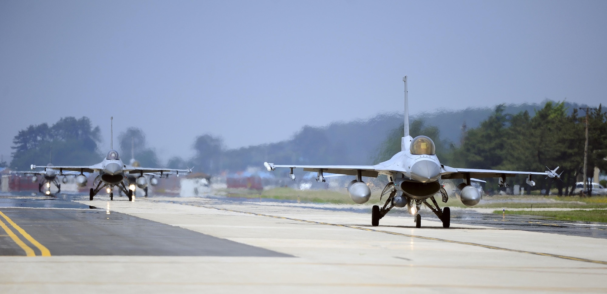 South Korean air force F-16 Fighting Falcons from the 123rd Tactical Fighter Squadron arrive at Kunsan Air Base, South Korea, for exercise Buddy Wing 15-4, June 1, 2015. Buddy Wing exercises are held multiple times throughout the year at various U.S. and South Korean air force bases to sharpen combined air combat tactics on the peninsula. (U.S. Air Force photo/Staff Sgt. Nick Wilson)