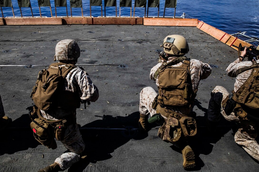 U.S. Marines with the 15th Marine Expeditionary Unit’s Maritime Raid Force aim at their targets aboard the USS Essex (LHD 2) at sea in the Pacific Ocean, June 1, 2015. These Marines frequently practice their marksmanship to stay well-prepared for anything they may face on deployment. (U.S. Marine Corps photo by Cpl. Anna Albrecht/Released)