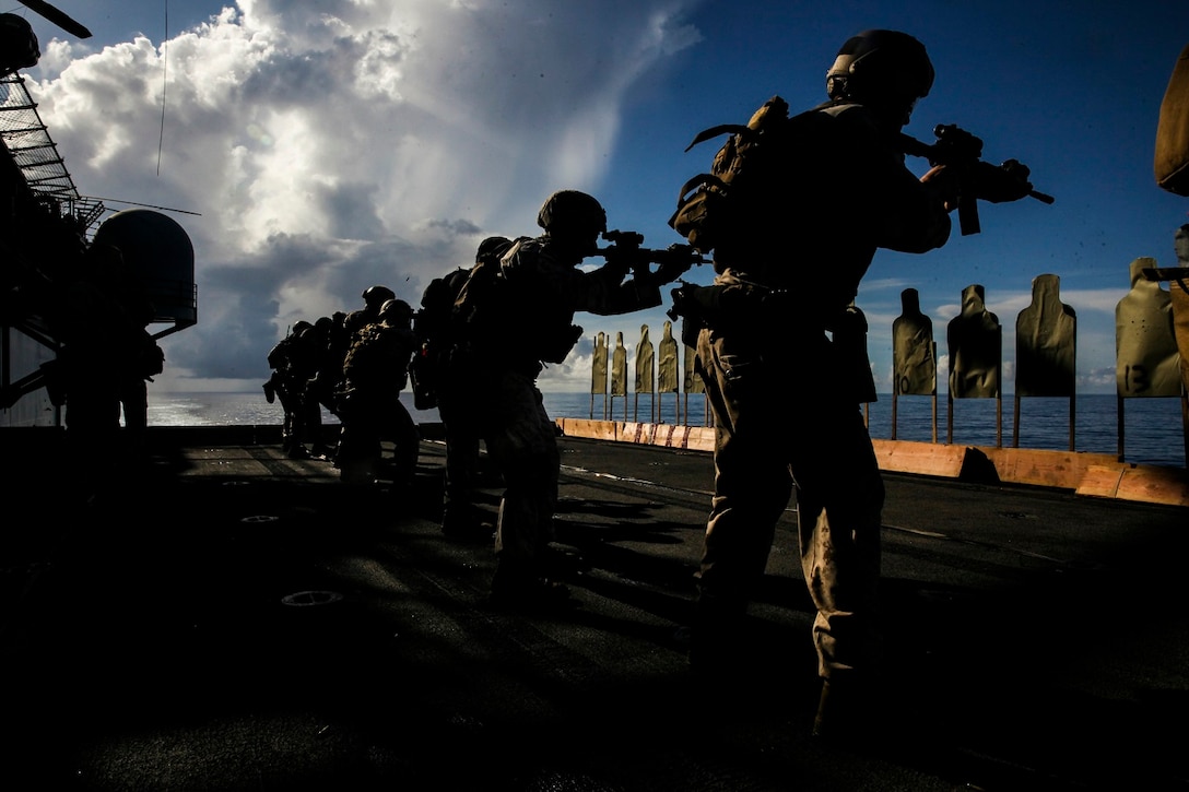 U.S. Marines with the 15th Marine Expeditionary Unit’s Maritime Raid Force sight in on their targets aboard the USS Essex (LHD 2) at sea in the Pacific Ocean, June 1, 2015. These Marines frequently practice their marksmanship to stay well-prepared for anything they may face on deployment. (U.S. Marine Corps photo by Cpl. Anna Albrecht/Released)