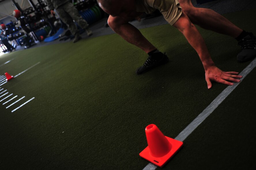 A member of the 26th Special Tactics Squadron touches the designated line while completing an agility assessment during a physical fitness standards study, May 5, 2015, at Cannon Air Force Base, N.M. The results of this study will help the Air Force Fitness Unit develop and validate recommendations for occupationally-specific, operationally-relevant, and gender-neutral physical tests and standards. (U.S. Air Force photo/ Senior Airman Eboni Reece)