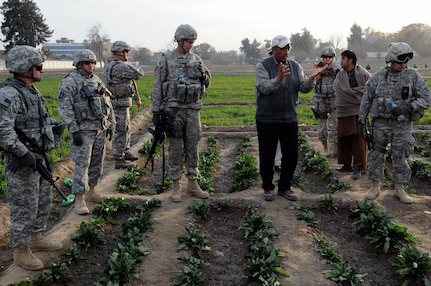 Dr. Hamdy Oushy, forage and rangeland specialist for the Afghanistan Water, Agriculture and Technology Transfer Project, gives a presentation to the commanders of the Iowa National Guard's 734th Agribusiness Development Team, the Illinois National Guard's 1-14th Agribusiness Team, Missouri ADT IV and Missouri ADT V at the Shishem Bagh Research Station Jan. 28. Leaders of the ADTs met in Jalalabad Jan. 28 for an ADT conference.