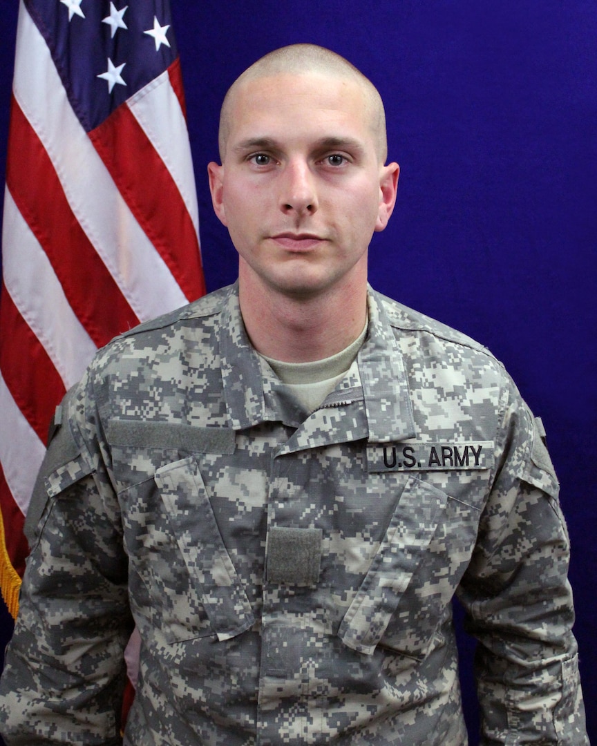 Private Kant poses for a portrait following his graduation ceremony from the National Guard GED Plus program at Camp Robinson in North Little Rock, Ark., Friday, Jan. 28.