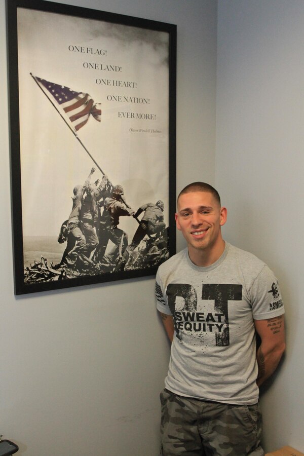 Bill Felmer poses for a photograph in his office at the Core Fitness Health Club, on May 5. Felmer recently became the first veteran to complete Western Connecticut State University’s Honors Program while obtaining a bachelor’s degree in political science. The 28-year-old Marine veteran is a Bethel, Connecticut native. (Official Marine Corps photo by Staff Sgt. Richard Blumenstein).