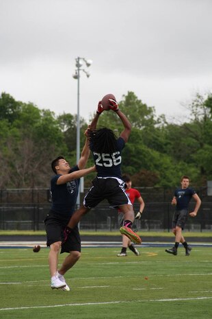 Two athletes face off for the ball during the RS Indianapolis Semper Fidelis All-American Football Camp at Decatur Central High School's May 31, 2015. The Semper Fidelis All-American Football Camp is the nation's premiere high school football camp series and bowl game presented by the United States Marine Corps.