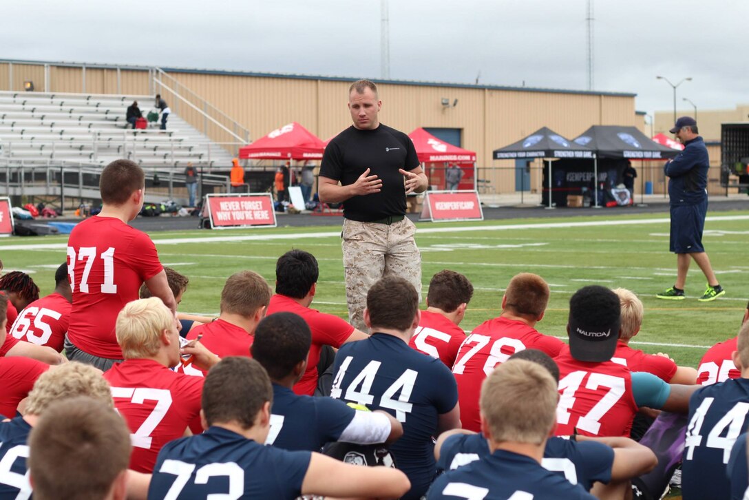 Staff Sgt Justin Hammer from Marine Corps Recruiting Station Indianapolis delivered a speech to players from across the region, during the RS Indianapolis Semper Fidelis All-American Football Camp at Decatur Central High School's May 31, 2015. The Semper Fidelis All-American Football Camp is the nation's premiere high school football camp series and bowl game presented by the United States Marine Corps.