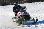 A National Guardsman competes in the USCC National Guard Cross-Country Snowmobile Championship. The team, which was comprised of one North Dakota Guardsmen and two from Minnesota, placed third in the event.