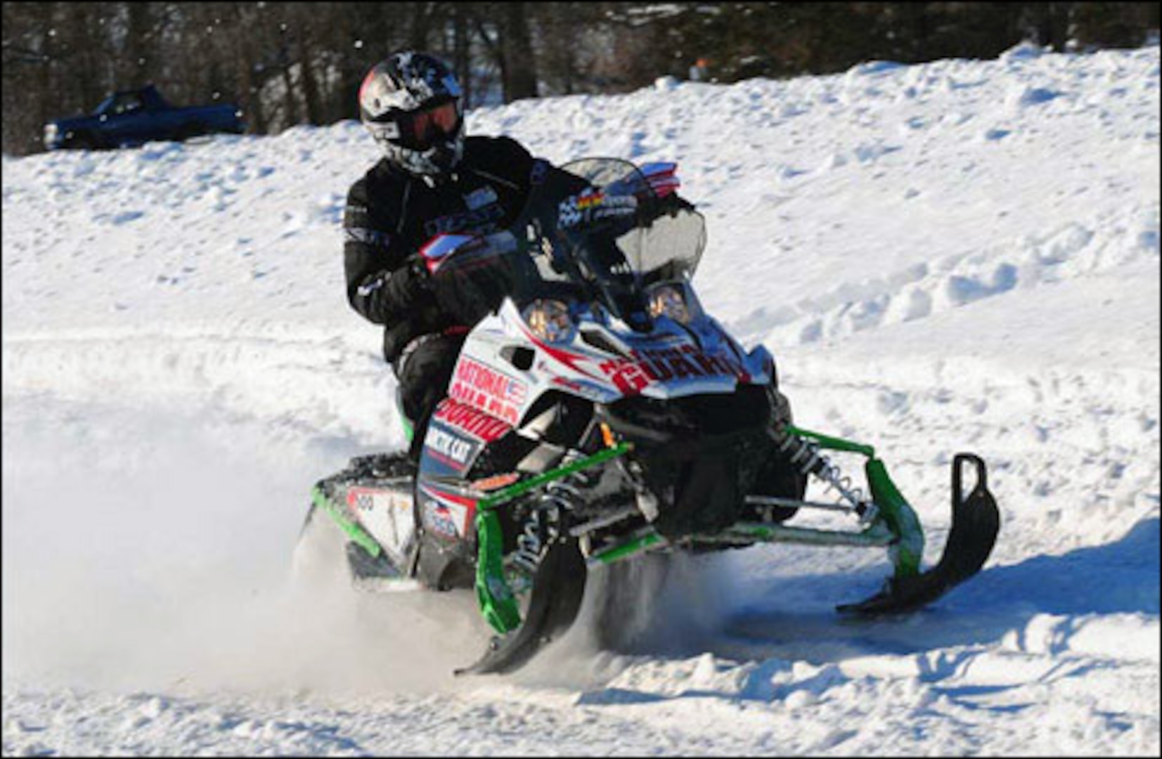 A National Guardsman competes in the USCC National Guard Cross-Country Snowmobile Championship. The team, which was comprised of one North Dakota Guardsmen and two from Minnesota, placed third in the event.