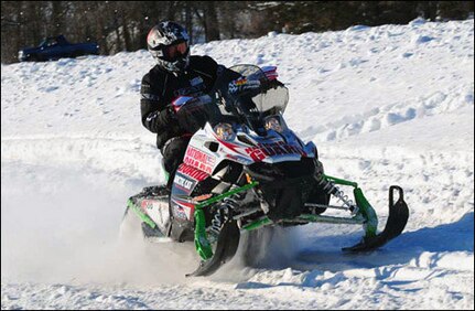 A National Guardsman competes in the USCC National Guard Cross-Country Snowmobile Championship. The team, which was comprised of one North Dakota Guardsmen and two from Minnesota, placed third in the event.