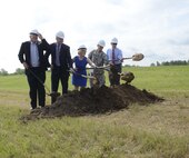Greg Grisson, Pennyrile Electric Cooperative Corp. President/CEO, Tony Dotson, University of Kentucky Veterans Resource Center coordinator, Kenya Stump, assistant director for renewable energy for the Kentucky Department for Energy Development and Independence, Fort Campbell Garrison Commander Col. David "Buck" Dellinger and Director of Public Works Jim Duttweiler break ground May 27 at the site of a new solar array on post that will eventually provide 5 megawatts of renewable energy. 