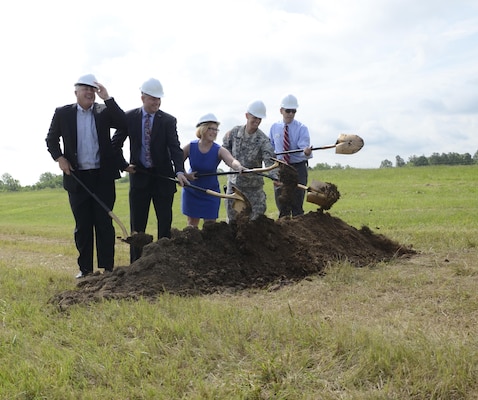 Greg Grisson, Pennyrile Electric Cooperative Corp. President/CEO, Tony Dotson, University of Kentucky Veterans Resource Center coordinator, Kenya Stump, assistant director for renewable energy for the Kentucky Department for Energy Development and Independence, Fort Campbell Garrison Commander Col. David "Buck" Dellinger and Director of Public Works Jim Duttweiler break ground May 27 at the site of a new solar array on post that will eventually provide 5 megawatts of renewable energy. 