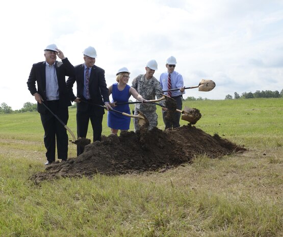 Greg Grisson, Pennyrile Electric Cooperative Corp. President/CEO, Tony Dotson, University of Kentucky Veterans Resource Center coordinator, Kenya Stump, assistant director for renewable energy for the Kentucky Department for Energy Development and Independence, Fort Campbell Garrison Commander Col. David "Buck" Dellinger and Director of Public Works Jim Duttweiler break ground May 27 at the site of a new solar array on post that will eventually provide 5 megawatts of renewable energy. 