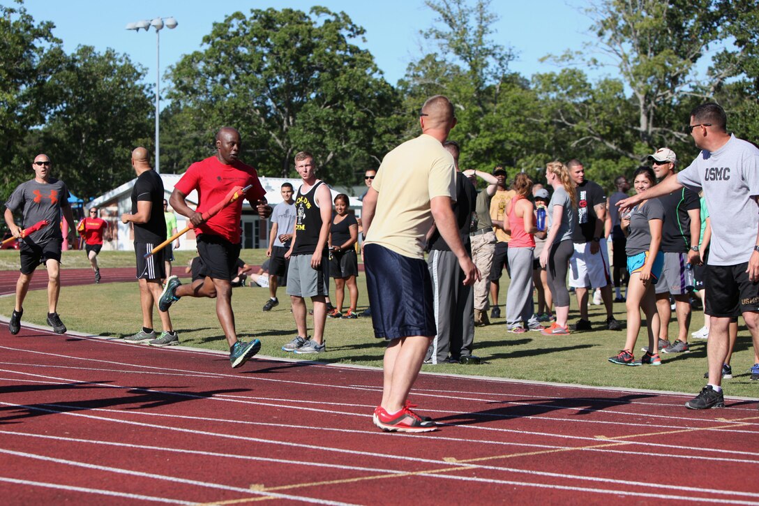 Marines participate in a relay race during a field meet at Marine Corps Air Station Cherry Point, N.C., May 29, 2015. Marines with Marine Wing Support Squadron 271 went head-to-head with each other in a tug-of-war, a 7-ton pull, relay races and other events to build teamwork, camaraderie and spirit-de-corps.
