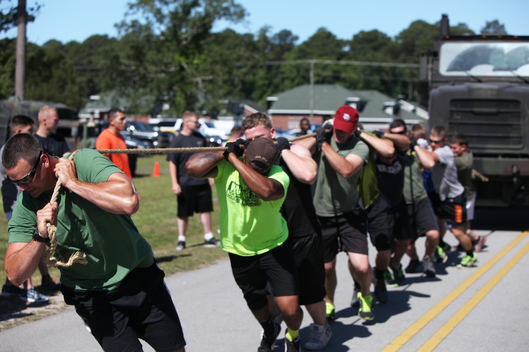 Marines with Marine Wing Support Squadron 271 pull a seven-ton tactical vehicle during a field meet at Marine Corps Air Station Cherry Point, N.C., May 29, 2015. Squadron Marines went head-to-head with each other in a tug-of-war, a 7-ton pull, relay races and other events to build teamwork, camaraderie and spirit-de-corps.