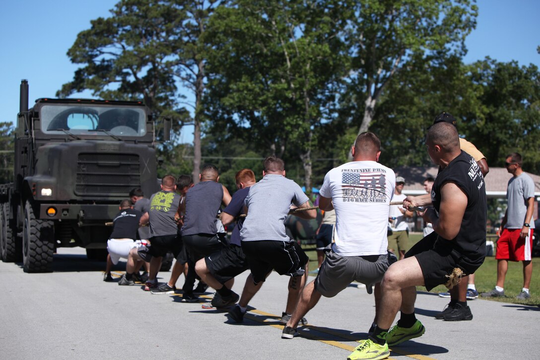 Marines with Marine Wing Support Squadron 271 pull a seven-ton tactical vehicle during a field meet at Marine Corps Air Station Cherry Point, N.C., May 29, 2015. Squadron Marines went head-to-head with each other in a tug-of-war, a 7-ton pull, relay races and other events to build teamwork, camaraderie and spirit-de-corps.
