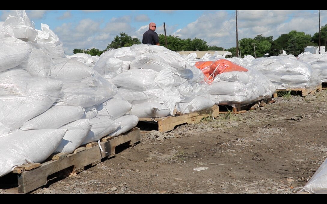 Heath Underwood, Wagoner County Emergency Manager, counts pallets of sandbags waiting to be shipped by the Oklahoma Department of Transportation to communities around the state. Wagoner was designated as the distribution point for sandbag filling.