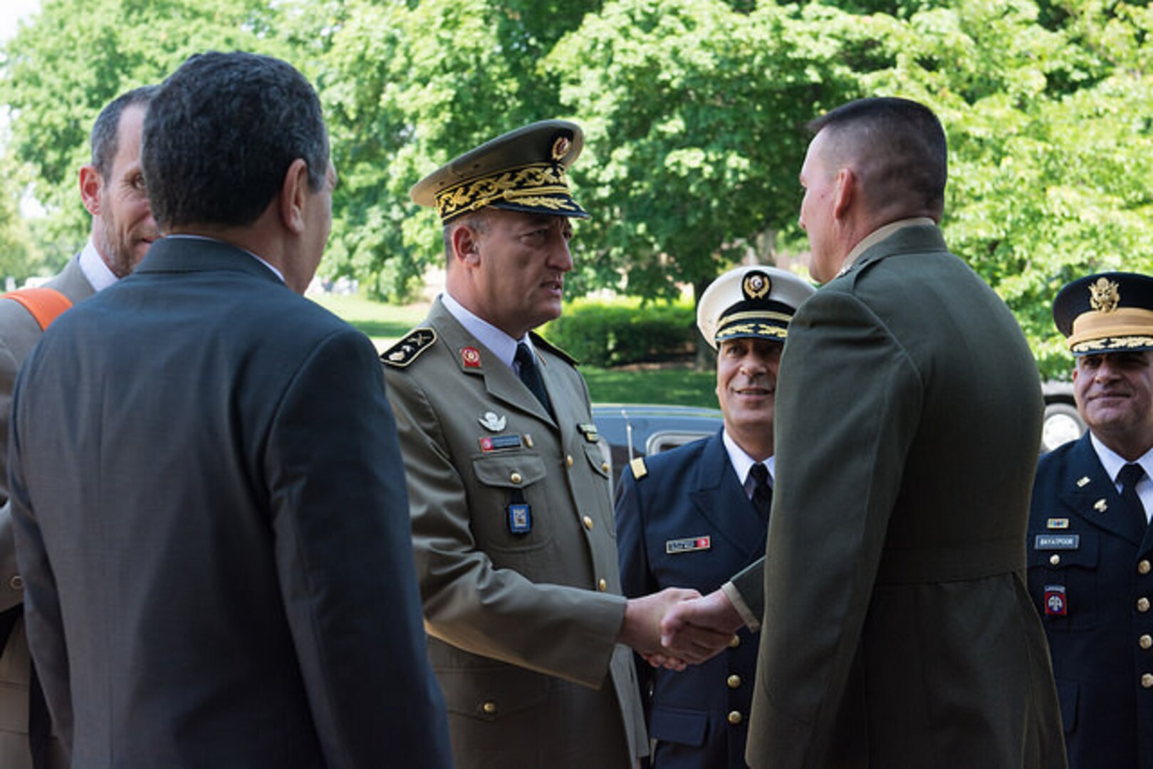 NDU President Major General Frederick Padilla (USMC) greets the Tunisian delegation.