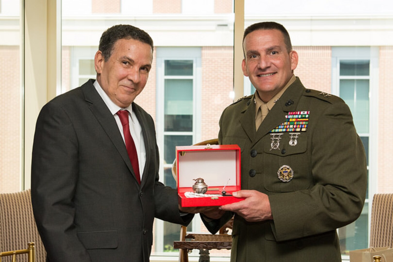 Tunisian Minister of Defense His Excellency Farhat Horchani and NDU President Major General Frederick Padilla (USMC) exchange gifts.