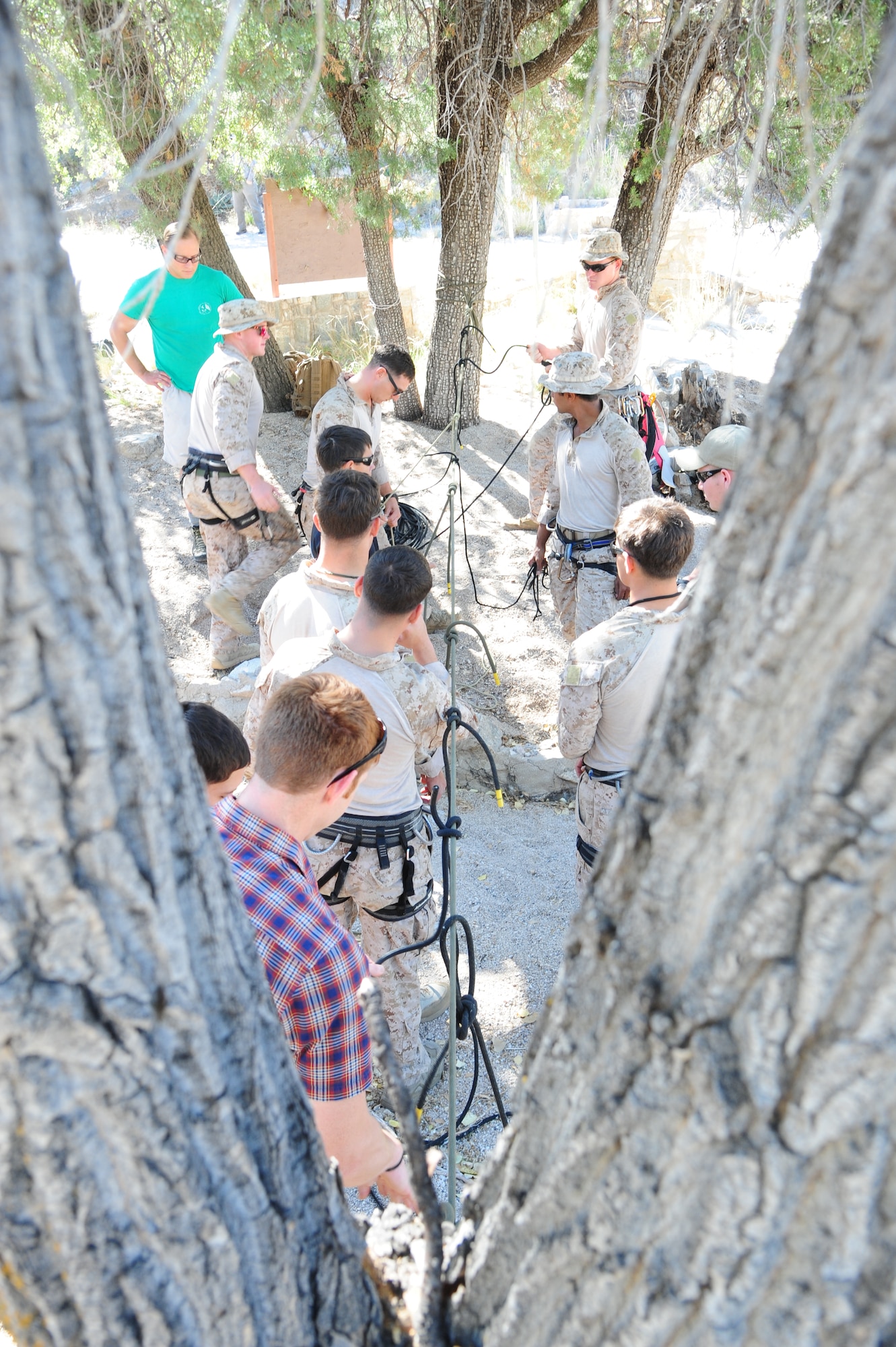 U.S. Air Force Reserve Airmen and U.S. Marines practice tying various knots used in rappelling during Angel Thunder 2015 high angle rescue training at Mount Lemmon, Ariz., June 1, 2015. During the training, the U.S. Marines and U.S. Airmen also practiced how to anchor ropes, rappelling down a cliffside unassisted, and returning to the initial elevation point. Angel Thunder is an Air Combat Command-sponsored personnel recovery exercise for combat air force, joint, allied and interagency participants. The Marines are stationed at Camp Pendleton, Calif., and the Airmen are assigned to the 304th RQS at Portland Air National Guard Base, Ore. (U.S. Air Force photo by Senior Airman Betty R. Chevalier/Released)