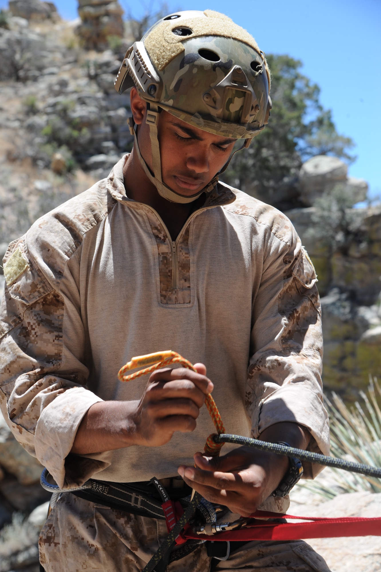 U.S. Navy Hospital Corpsman 3rd Class Chris Trinidad, special amphibious reconnaissance corpsman, makes a unassisted hand brake during Angel Thunder 2015 high angle rescue training at Mount Lemmon, Ariz., June 1, 2015. During the training, U.S. Marines and U.S. Airmen practiced tying knots, anchoring ropes properly, rappelling down a cliffside unassisted, and returning to the initial elevation point. Trinidad is assigned to Force Company, 1st Reconnaissance Battalion, 1st Marine Division at Camp Pendleton, Calif. (U.S. Air Force photo by Tech. Sgt. Courtney Richardson/Released)