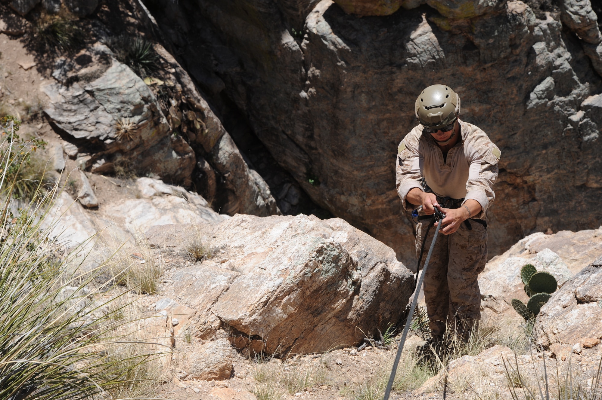 U.S. Marine Sgt. Preston Gabaldon, reconnaissance Marine, rappels down a cliffside during Angel Thunder 2015 high angle rescue training at Mount Lemmon, Ariz., June 1, 2015. During the training, U.S. Marines and U.S. Airmen practiced tying knots, anchoring ropes properly, rappelling down a cliffside unassisted, and returning to the initial elevation point. LaFrance is a assigned to Force Company, 1st Reconnaissance Battalion, 1st Marine Division at Camp Pendleton, Calif. (U.S. Air Force photo by Tech. Sgt. Courtney Richardson/Released)
