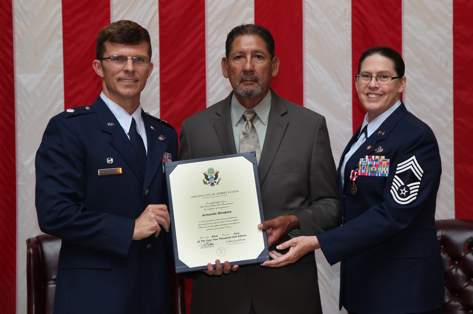 TRAVIS AIR FORCE BASE, Calif. -- Chief Master Sgt. Nancy E. Hinojosa, 749th Aircraft Maintenance Squadron flight superintendent, is honored by members of the 940th Wing, 60th Air Mobility Wing and the 349th Air Mobility Wing in a retirement ceremony at Travis Air Force Base, Calif., May 17, 2015. (U.S. Air Force photo/Lt. Col. Robert Couse-Baker/Released)
