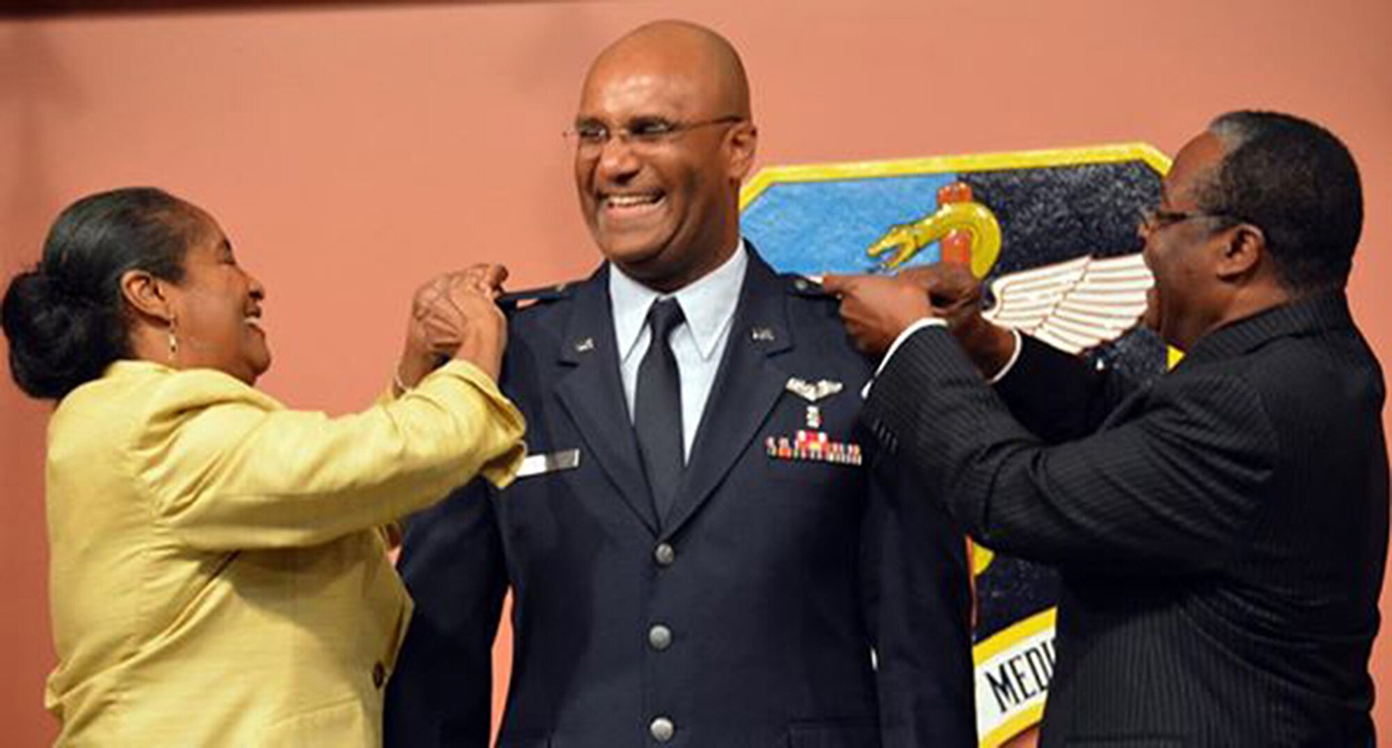 Col. Gerard Bazile, 349th Aerospace Medicine Squadron, is pinned on by his parents May 17, 2015 at David Grant USAF Medical Center, Travis Air Force Base, Calif. (U.S. Air Force photo/Staff Sgt. Christopher Carranza)

