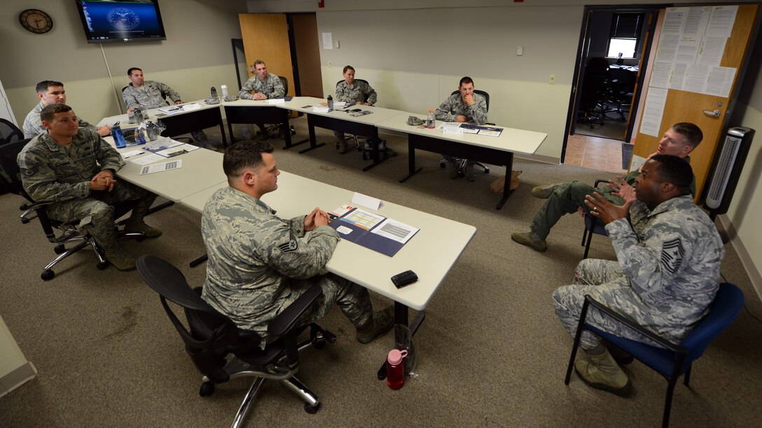 U.S. Air Force Chief Master Sgt. Eddie Webb, 7th Bomb Wing command chief, addresses noncommissioned officers during a  NCO Professional Enhancement seminar May 12, 2015, at Dyess Air Force Base, Texas. Webb serves as the primary advisor to the wing commander on matters concerning the moral, welfare, training, professional development, career progression and effective utilization of the base enlisted force. (U.S. Air Force photo by Airman 1st Class Kedesha Pennant/Released)