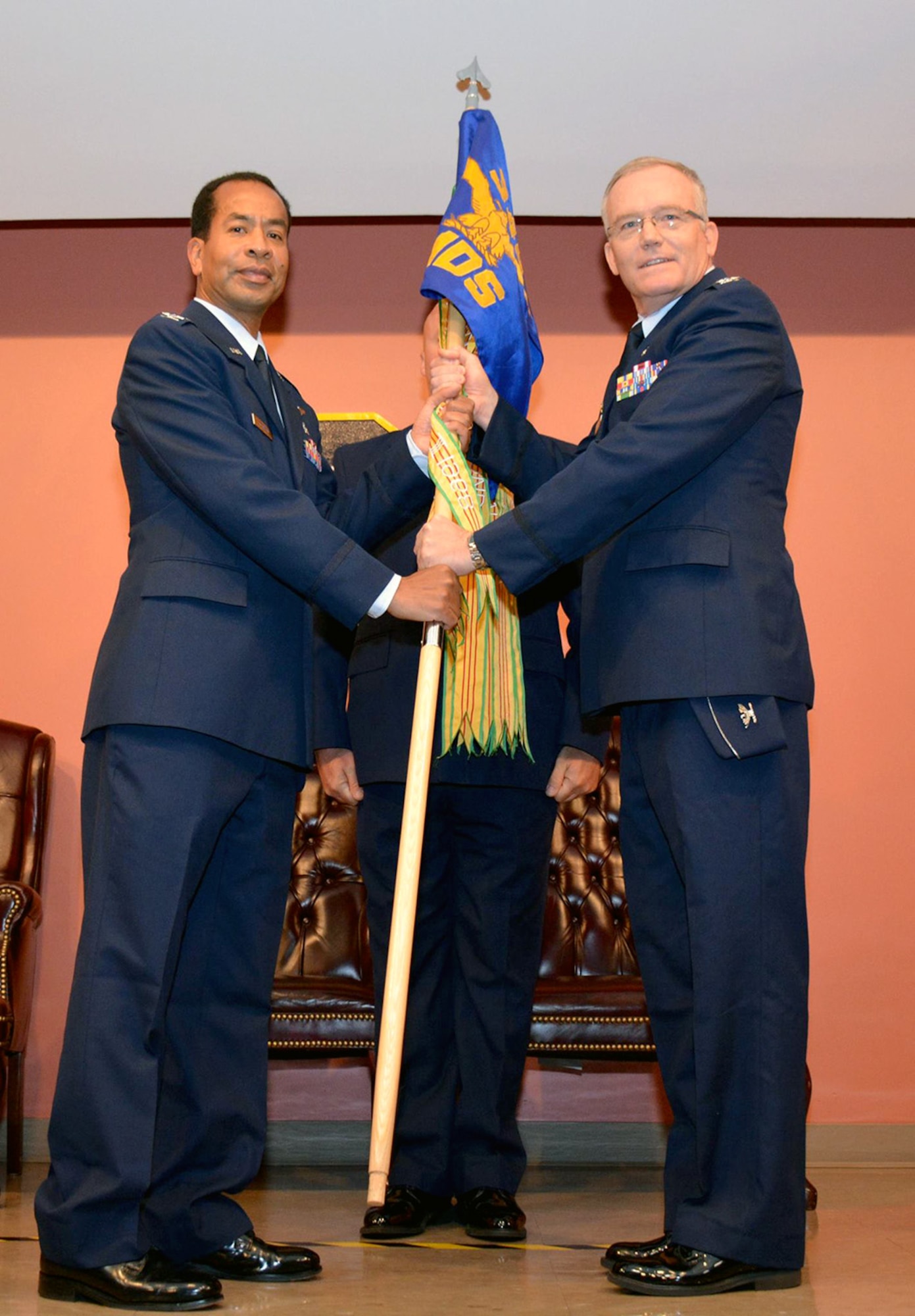At a 349th Medical Squadron Change of Command ceremony, Col. George Z. Friedman Jr. relinquishes command to the assuming commander, Col. Edward G. Johnson Saturday, May 16, 2015 at the David Grant USAF Medical Center auditorium. (U.S. Air Force photos/Senior Airman Madelyn Brown)
