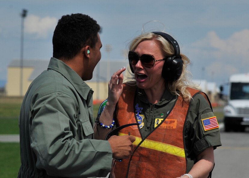 Brayden Hill, U.S. Air Force Academy cadet, surprises his mom, Suzette Hill, during his father’s, Col. Brian Hill, 92nd Air Refueling Wing vice commander, final flight celebration May 29, 2015, at Fairchild Air Force Base, Wash. The Hills did not know their son was in town and were surprised and delighted to see that he had shown up for his father’s final flight. (U.S. Air Force photo/Airman 1st Class Taylor Bourgeous)
