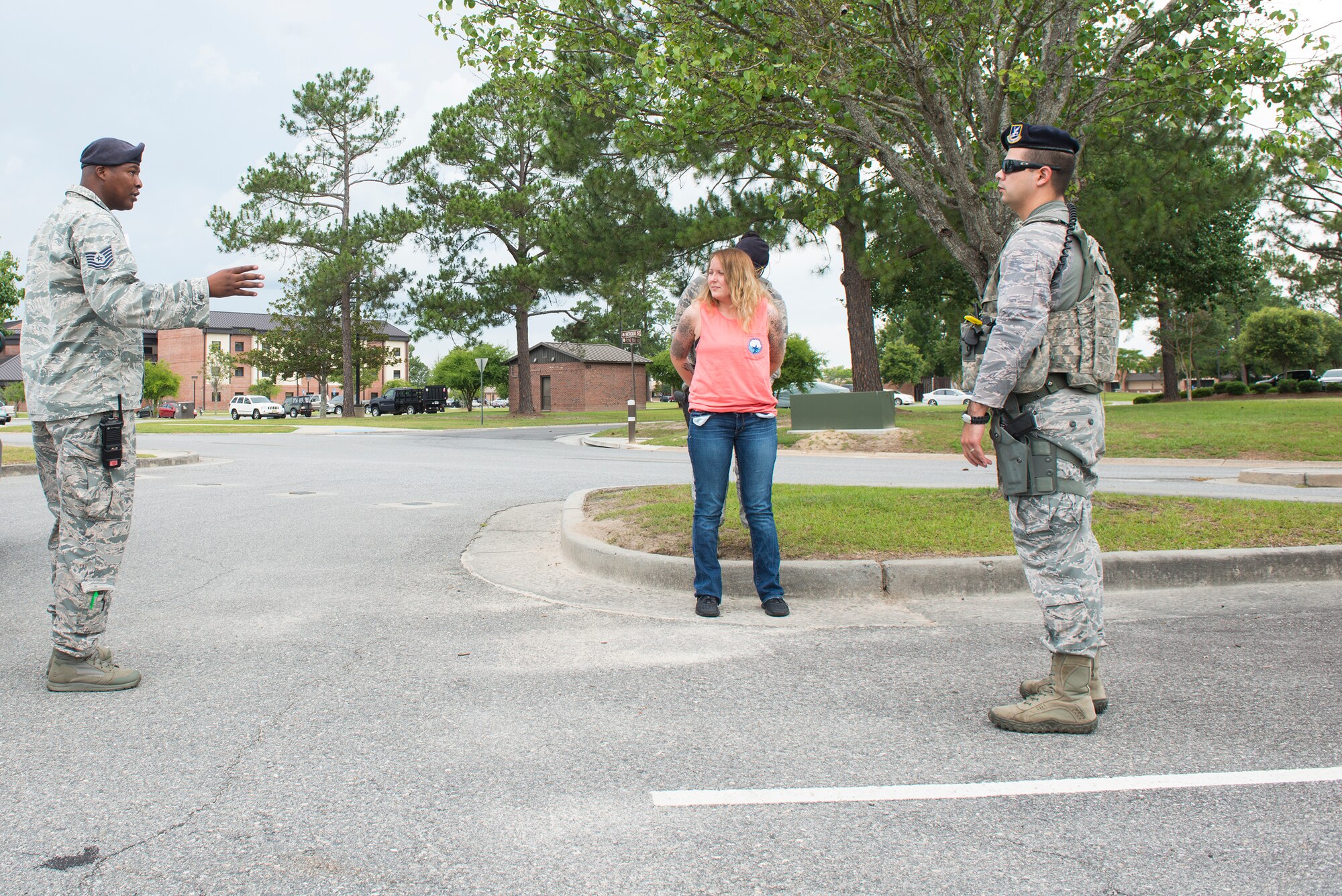 U.S. Air Force Tech. Sgt. James Jefferson, 23d Security Forces Squadron NCO in charge of operations, provides feedback to his Airmen during an anti-robbery exercise June 1, 2015, at Moody Air Force Base, Ga. The intent of the exercise was to evaluate how well the wing could respond to a robbery incident. (U.S. Air Force photo by Airman 1st Class Ceaira Tinsley/Released)