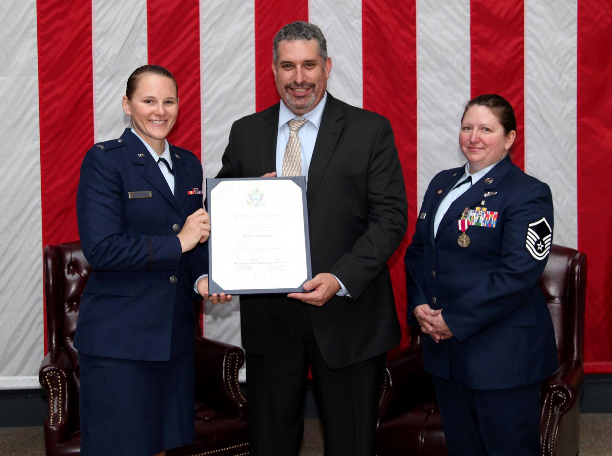 TRAVIS AIR FORCE BASE, Calif. -- Master Sgt. Denise C. Laycock, 349th Maintenance Group career advisor, is honored in a retirement ceremony at Travis AFB, Calif., May 16, 2015. (U.S. Air Force photo/Lt. Col. Robert Couse-Baker/Released