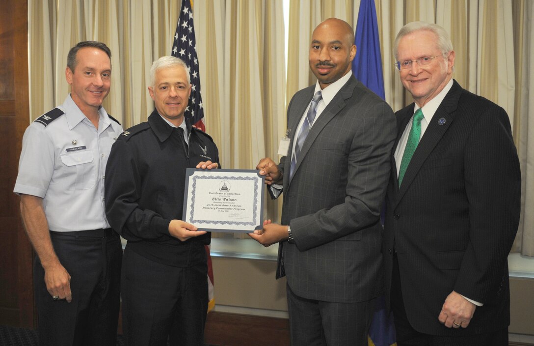 Ellis Watson, center right, chief executive for Councilman Obie Patterson, 8th District, Prince George’s County, receives a certificate from Col. Robert Licciardi, 89th Airlift Support Group; Col. Bradley Hoagland, far left, 11th Wing/Joint Base Andrews commander; and Jim Estepp, far right, Andrews Business & Community Alliance president and chief executive officer and Senior Andrews Ambassador, May 29, 2015, at The Club, Joint Base Andrews, Md. The Joint Base Andrews Honorary Commander Program encourages an exchange of ideas and experiences, as well as partnerships between key leaders of the base's surrounding communities, JBA commanders and Airmen.  (U.S.  Air Force photo by Senior Airman Preston Webb/RELEASED)