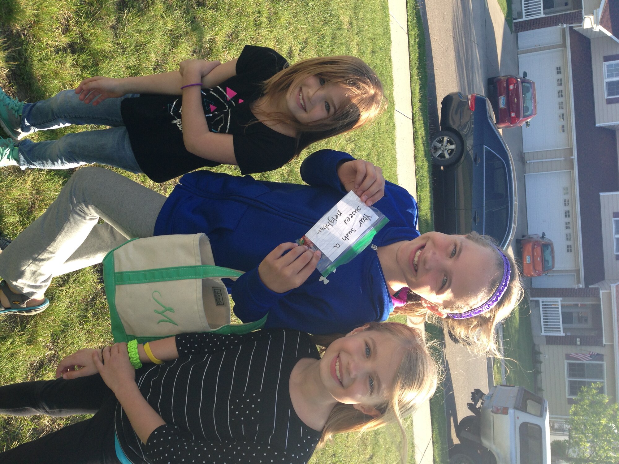 Alex Dodgen, Makenna Peterson and Zayla Dodgen, students at Dakota Elementary School, show the card the made while participating in the random acts of kindness event at their school at Minot Air Force Base, N.D., June 2, 2015. At the beginning of May, the students learned about what RAOKs are and how they can make a difference. (Courtesy photo)  