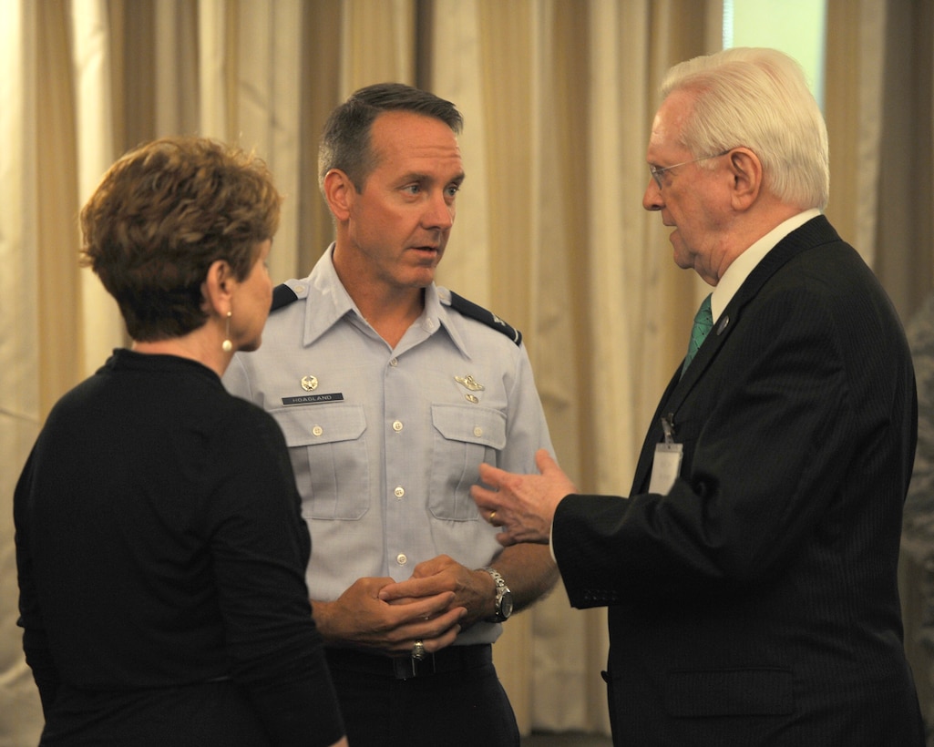 Col. Bradley Hoagland, 11th Wing/Joint Base Andrews commander, speaks with Senior Andrews Ambassador, Jim Estepp, Andrews Business & Community Alliance president and chief executive officer and his wife, Nancy, during the Joint Base Andrews 2015 Honorary Commander Luncheon May 29, 2015, at The Club, JBA, Md. The Joint Base Andrews Honorary Commander Program encourages an exchange of ideas and experiences, as well as partnerships between key leaders of the base's surrounding communities, JBA commanders and Airmen.  (U.S.  Air Force photo by Senior Airman Preston Webb/RELEASED)