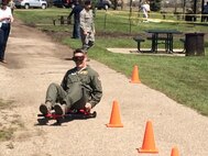 Col. Jason Armagost, 5th Bomb Wing commander, drives through the drunken goggle course during a safety fair at Minot Air Force Base, N.D., May 21, 2015. The drunken goggle course showed participants what it’s like to operate a vehicle while impaired. (Courtesy photo) 