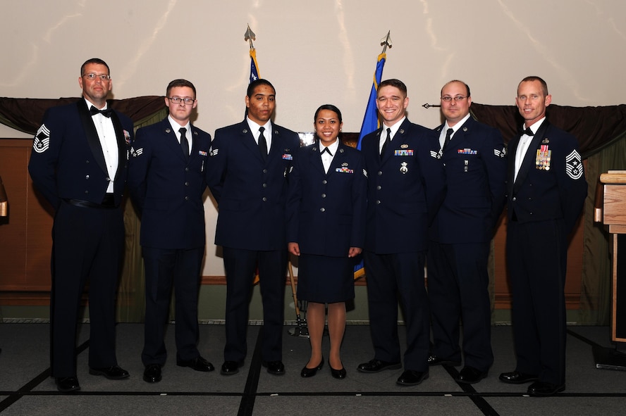 The Airman Leadership School Class 15-D graduated with 48 students during a ceremony held at the Jimmy Doolittle Center at Minot Air Force base, May 28, 2015. Congratulations to the graduates and special recognition to the following award winners: Commandant's Award: Senior Airman Benjamin Johnson, 91st Security Support Squadron; Academic Achievement Award: Senior Airman Connor Gurule, 5th Security Forces Squadron; Distinguished Graduate Awards: Senior Airman Connor Gurule 5th SFS, Senior Airman Benjamin Johnson 91st SSPTS, Senior Airman Robert Pruim 91st Operations Support Squadron, Senior Airman Hollykris Vergara, 5th Civil Engineer Squadron; John L. Levitow Award: Senior Airman Matthew Newton 91st OSS. Pictured here from left to right are: Chief Master Sgt. David Richard, 5th Maintenance Group wing weapons manager, Senior Airmen Matthew Newton, Connor Gurule, Hollykris Vergara, Benjamin Johnson, Robert Pruim and Chief Master Sgt. Geoff Weimer, 5th Bomb Wing command chief. (U.S. Air Force photo/Senior Airman Kristoffer Kaubisch)