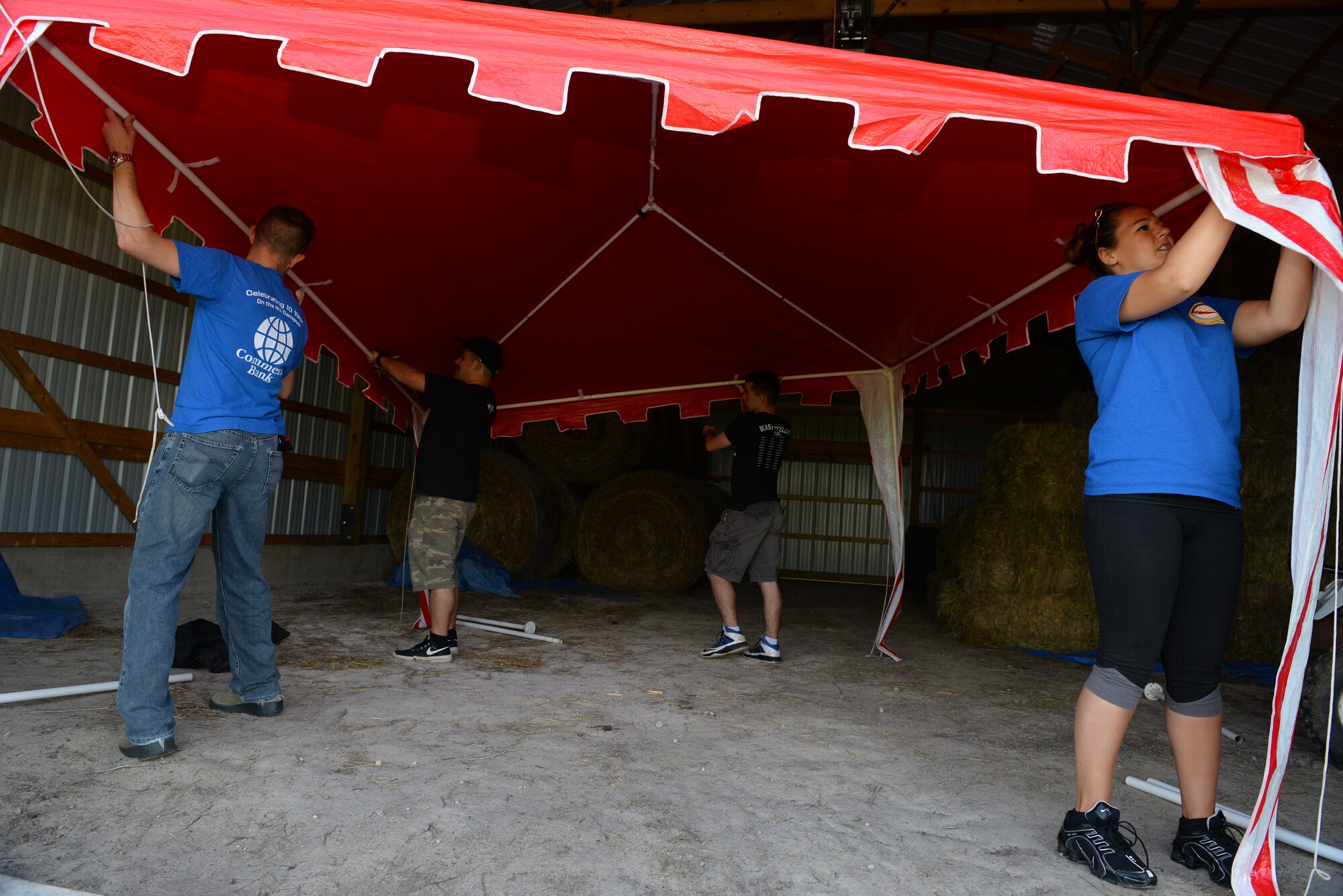 375th Operations Support Squadron Air Traffic Controllers assist with chores at Chakota, a therapeutic horseback riding center, Germantown, Illinois, May 28, 2015. One of the Airmen, Senior Airman Joshua Rose, has volunteered at Chakota before, bringing a group of Airmen with him to enhance the facility. This is one of the several instances where he rallies volunteer groups to make a bigger impact on community projects. (U.S. Air Force photo by Airman 1st Class Erica Crossen)