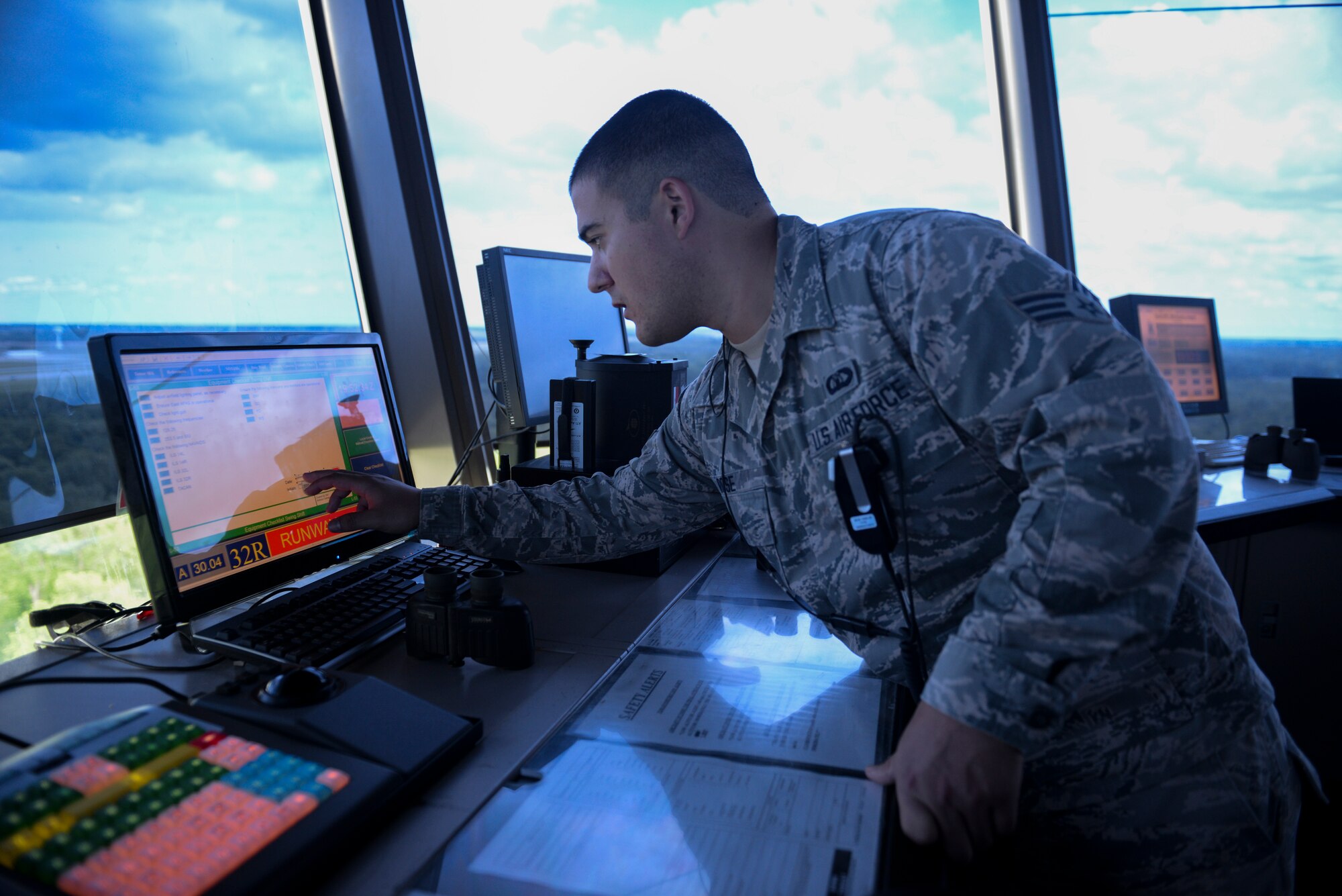 Senior Airman Joshua Rose, 375th Operations Support Squadron Air Traffic Controller, monitors flights within Scott Air Force Base, Illinois airspace, May 27, 2015. The Acushnet, Massachusetts native has been stationed at Scott for more than 2 years, and in his off duty time, he can found volunteering in the surrounding communities. (U.S. Air Force photo by Airman 1st Class Erica Crossen)