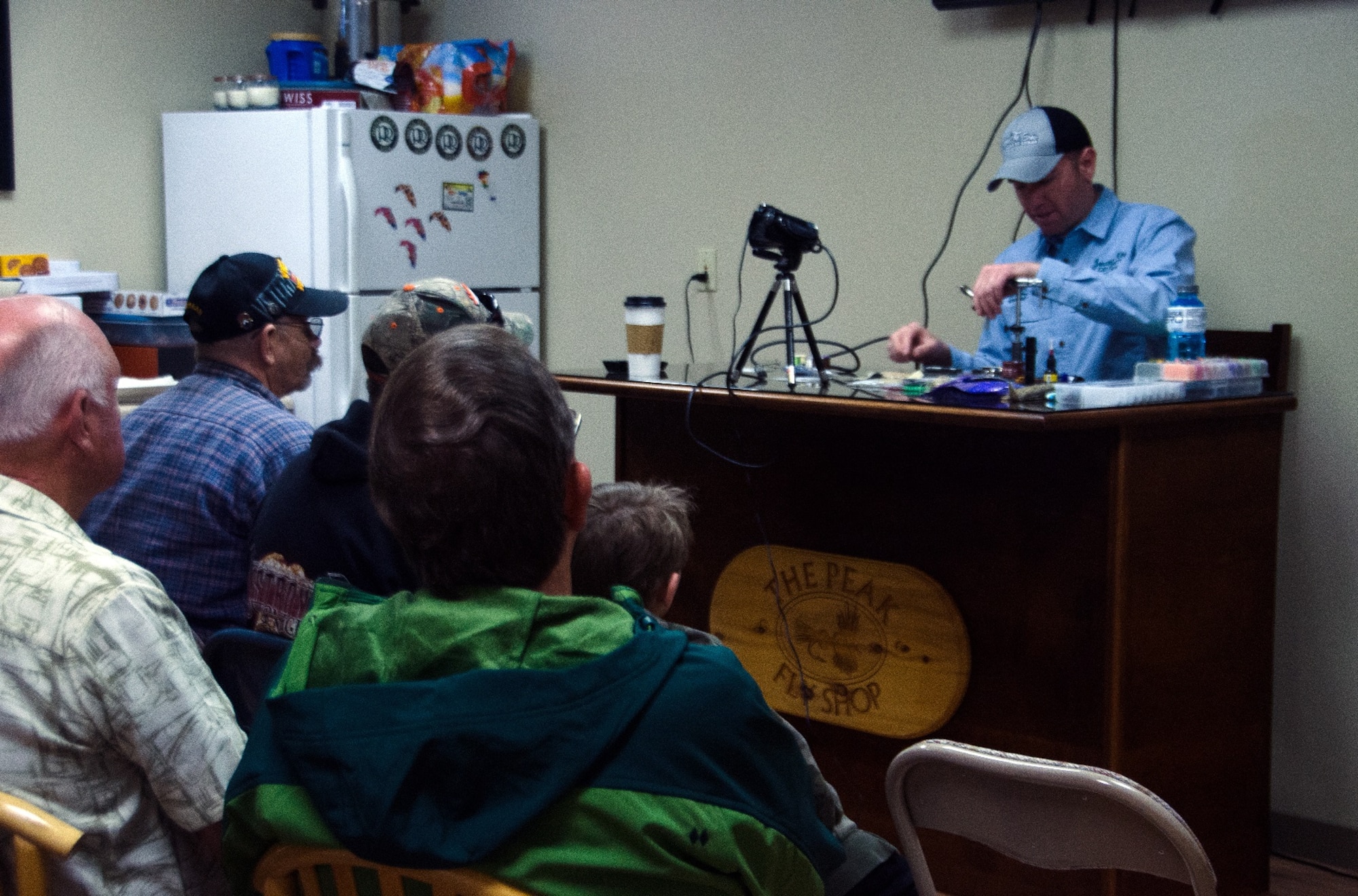 COLORADO SPRINGS, Colorado – Master Sgt. Jonathan Kiley, Vosler NCO Academy instructor, teaches members of Project Healing Waters how to tie a fly. Kiley has been a volunteer for the Colorado Springs Project Healing Waters for approximately two years teaching members how to tie flies, and also a program manager creating different levels of courses for non-experienced and experienced fly tiers. (Photo courtesy Master Sgt. Jonathan Kiley)