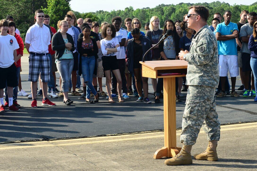 U.S. Army Col. William Galbraith, 733rd Mission Support Group commander, welcomes a group of local high school students during a mission orientation day at Fort Eustis, Va., May 29, 2015. During his welcoming, Galbraith informed the students that the focus of the day was science, technology engineering and mathematics or STEM. (U.S. Air Force photo by Senior Airman Kimberly Nagle/Released)  