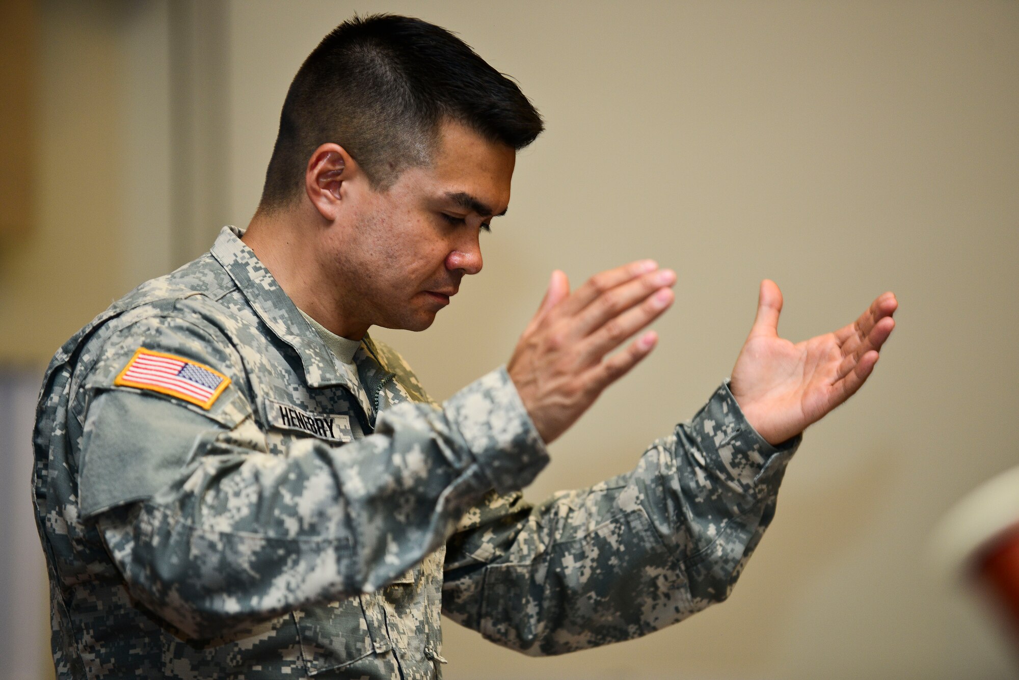 U.S. Army 2nd Lt. Richard Henebry, U.S. Army Training Doctrine and Command Band executive officer leads the concert band at Fort Eustis, Va., June 1, 2015. Henebry, conducted the group throughout the rehearsal repeating several sections for the “Music Under the Stars” summer concert series that begins June 4, and will conclude Aug. 27. (U.S. Air Force photo by Senior Airman Kimberly Nagle/Released)  