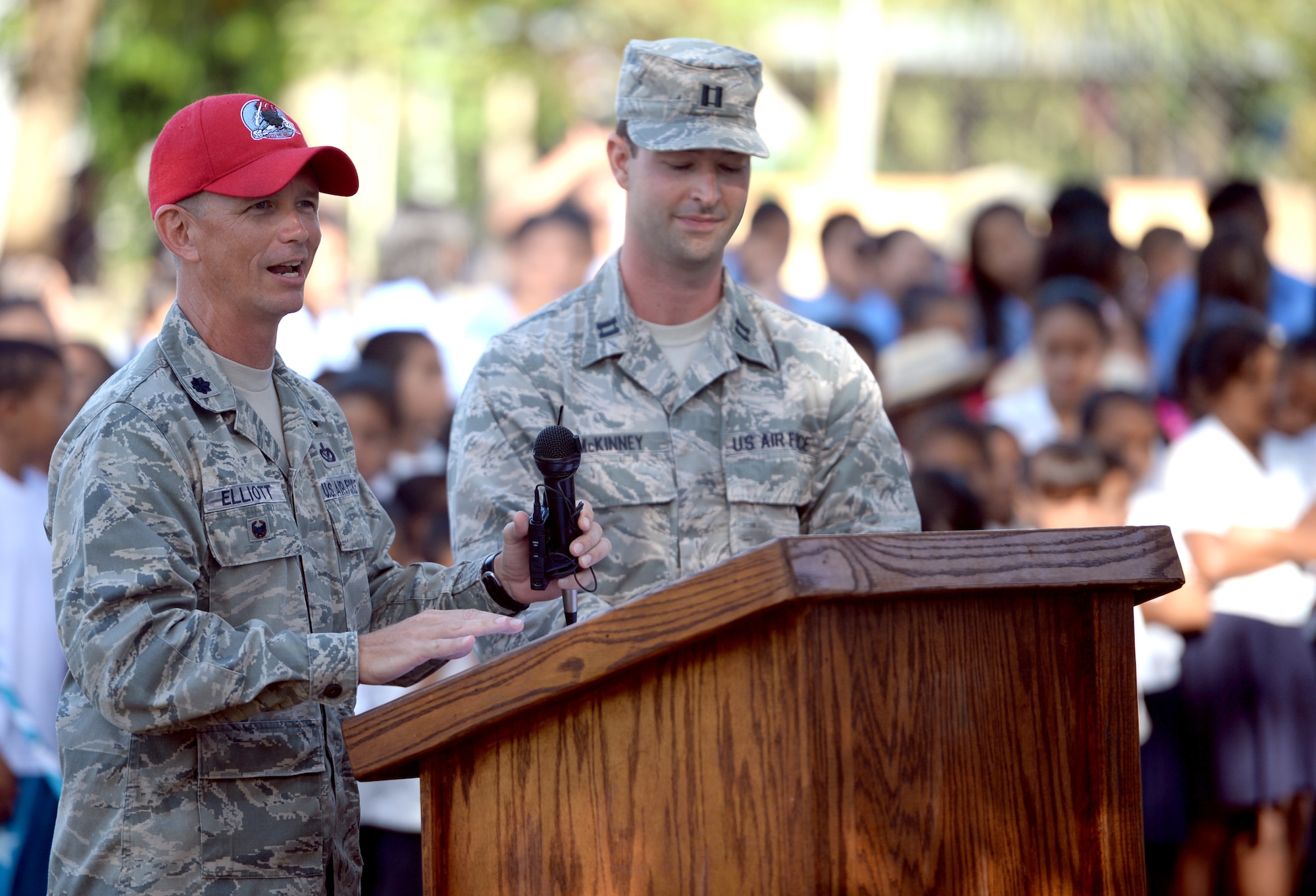 U.S. Air Force Lt. Col. Ryan Elliott, New Horizons Honduras commander and 823rd RED HORSE deputy commander and Grove City, Pa., speaks at the groundbreaking ceremony at the Gabriela Mistral primary school in Ocotoes Alto, Honduras, June 1, 2015. U.S. Air Force Capt. Austin McKinney, 8th Air Force Life Cycle Management Center deputy program manager out of Hanscom Air Force Base, Mass., and Canton, Mich., native, translates. The event also acted as an official start to the New Horizons exercise which will take place in and around the Trujillo and Tocoa areas. New Horizons was launched in the 1980s and is an annual joint humanitarian assistance exercise that U.S. Southern Command conducts with a partner nation in Central America, South America or the Caribbean. The exercise improves joint training readiness of U.S. and partner nation civil engineers, medical professionals and support personnel through humanitarian assistance activities. (U.S. Air Force photo by Capt. David J. Murphy/Released)