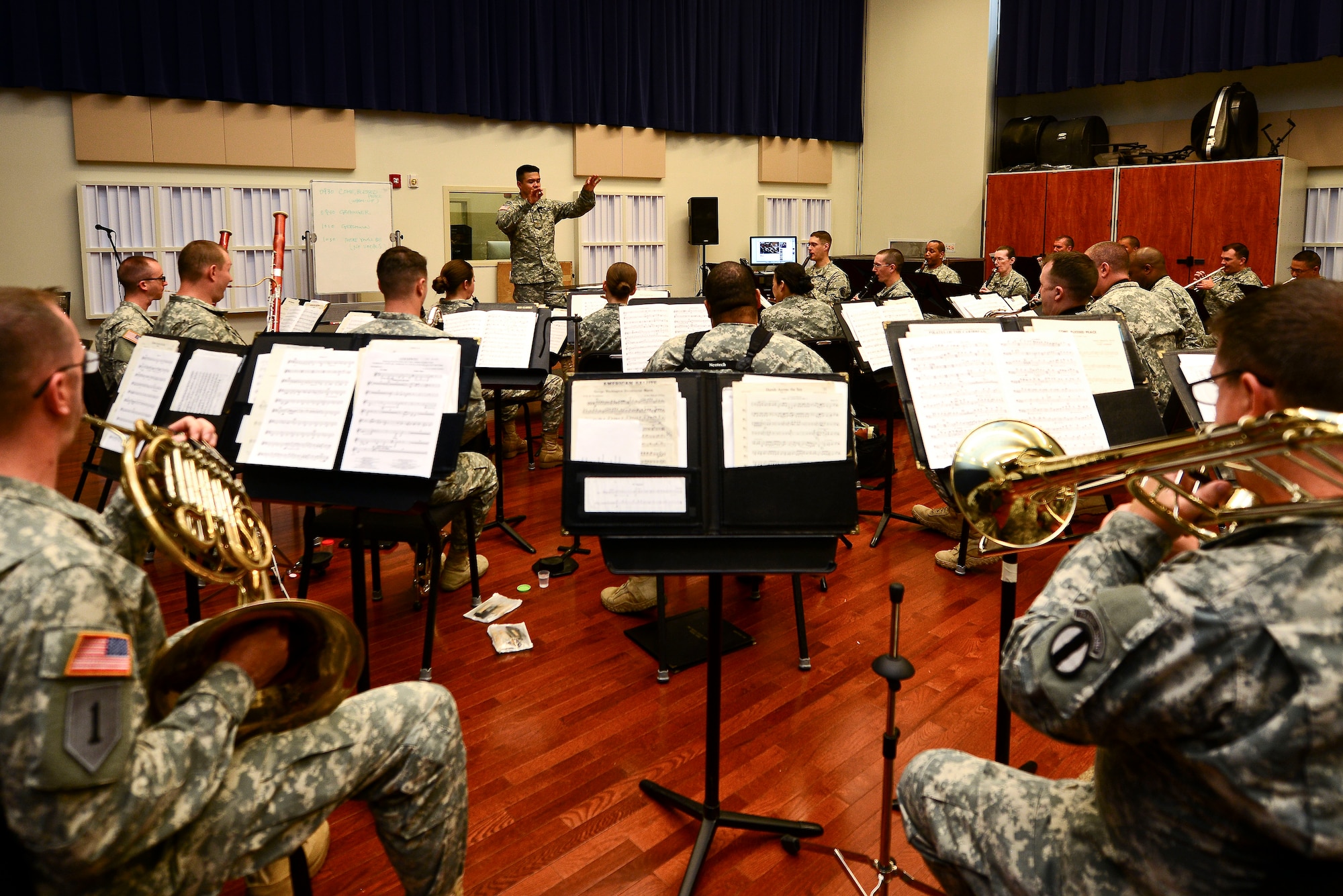 U.S. Army 2nd Lt. Richard Henebry, U.S. Army Training Doctrine and Command Band concert band executive officer leads band practice at Fort Eustis, Va., June 1, 2015. The band was practicing for their upcoming summer concert series, “Music Under the Stars.” (U.S. Air Force photo by Senior Airman Kimberly Nagle/Released)