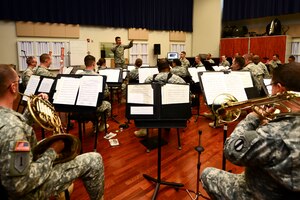 U.S. Army 2nd Lt. Richard Henebry, U.S. Army Training Doctrine and Command Band concert band executive officer leads band practice at Fort Eustis, Va., June 1, 2015. The band was practicing for their upcoming summer concert series, “Music Under the Stars.” (U.S. Air Force photo by Senior Airman Kimberly Nagle/Released)
