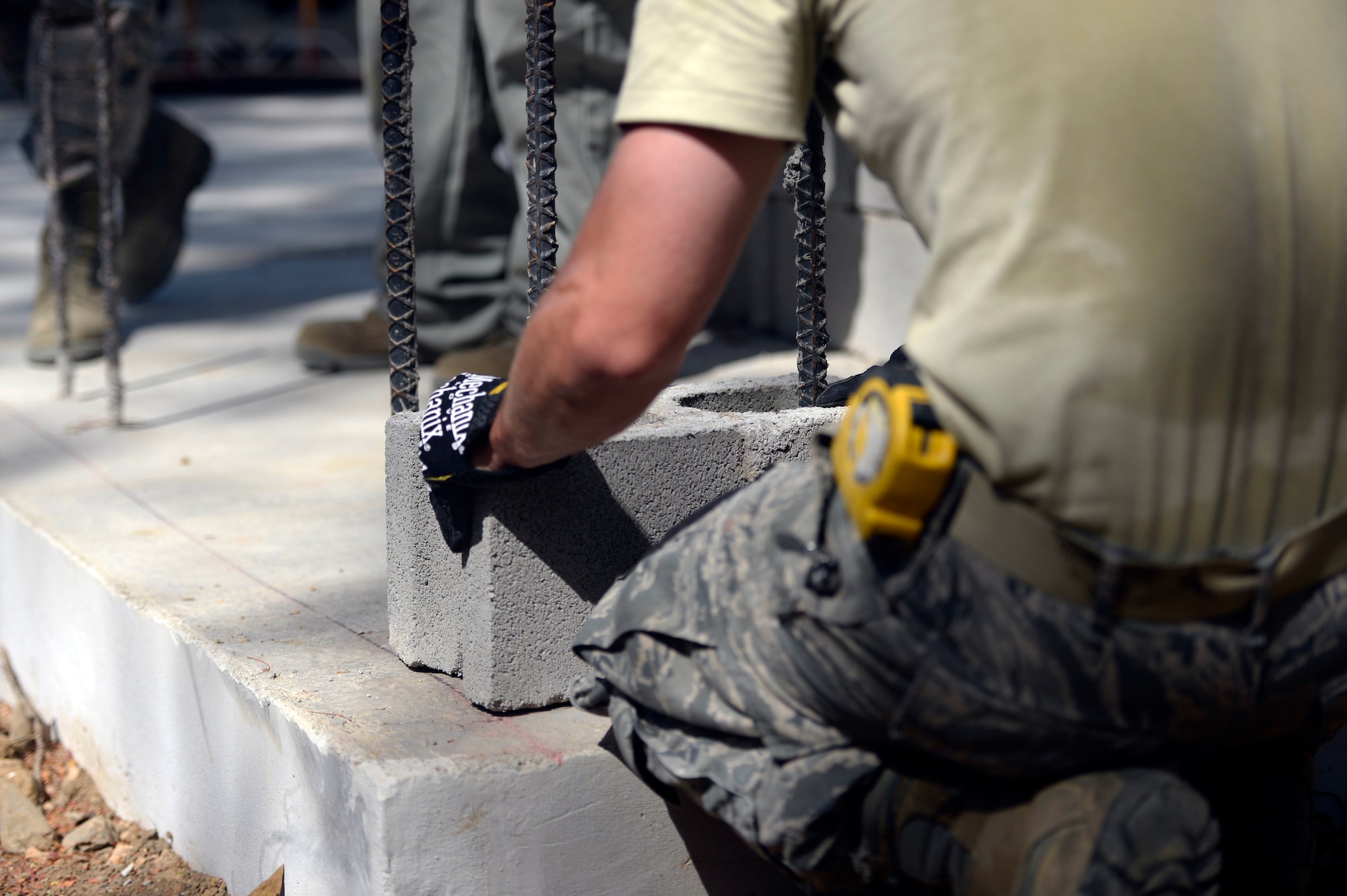 Staff Sgt. Nathaniel Rosier, 823rd Expeditionary RED HORSE Squadron structural supervisor, does what’s known as “chasing the band” to determine is the block he is laying will lay right when mortar is applied during construction at the Gabriela Mistral school in Ocotoes Alto, Honduras, June 1, 2015. Rosier, a Painesville, Ohio, native, is one part of the New Horizons Honduras 2015 training exercise taking place throughout Trujillo and Tocoa. U.S. Air Force Staff Sgt. Nathaniel Rosier, 823rd Expeditionary RED HORSE Squadron structural supervisor, does what’s known as “chasing the band” to determine is the block he is laying will lay right when mortar is applied during construction at the Gabriela Mistral school in Ocotoes Alto, Honduras, June 1, 2015. Rosier, a Painesville, Ohio, native, is one part of the New Horizons Honduras 2015 training exercise taking place throughout Trujillo and Tocoa. New Horizons was launched in the 1980s and is an annual joint humanitarian assistance exercise that U.S. Southern Command conducts with a partner nation in Central America, South America or the Caribbean. The exercise improves joint training readiness of U.S. and partner nation civil engineers, medical professionals and support personnel through humanitarian assistance activities. (U.S. Air Force photo by Capt. David J. Murphy/Released)