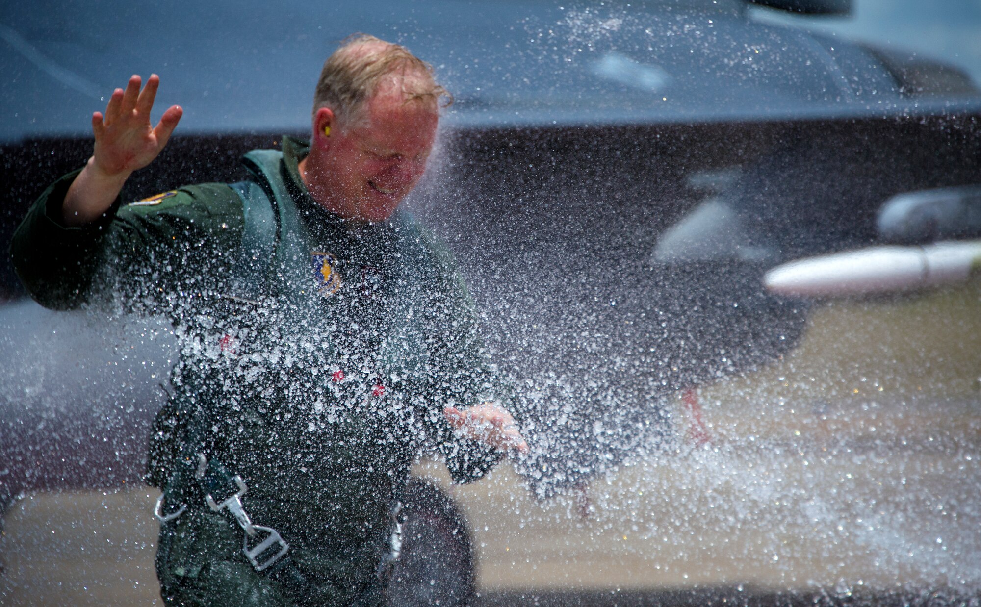Brig. Gen. David Harris, 96th Test Wing commander, gets hosed down after his fini flight May 27th at Eglin Air Force Base, Fla. The fini flight is a ceremony that symbolizes a members final flight in the unit and/or base.  Harris leaves Eglin June 4 to take command of the Air Force Test Center.  (U.S. Air Force photo/Senior Airman Brandi Hansen)