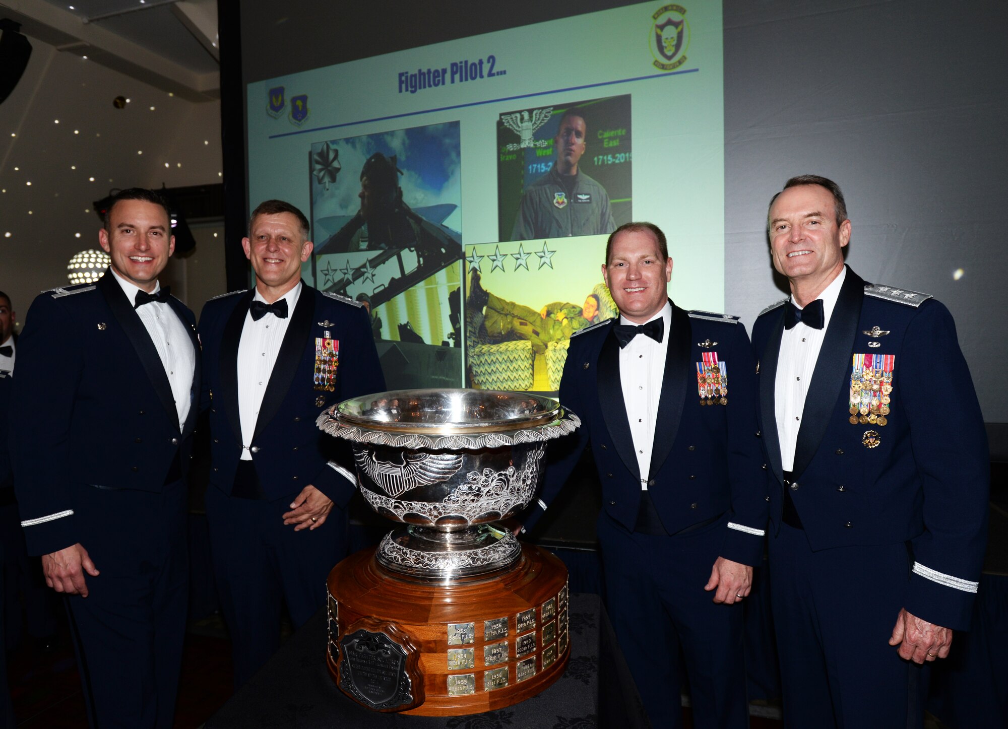 From left, Col. Robert Novotny, 48th Fighter Wing commander, Gen. Frank Gorenc, U.S. Air Forces in Europe and Air Forces Africa commander, Lt. Col. John Stratton, 493rd Fighter Squadron commander, and Lt. Gen. Darryl Roberson, 3rd Air Force and 17th Expeditionary Air Force commander, gather for a photo following the presentation of the 2014 Raytheon Trophy to the 493rd FS during a celebration May 29, 2015. The trophy dates to 1953 and is awarded annually to the top air superiority or air defense squadron in the U.S. Air Force. (U.S. Air Force photo by Tech. Sgt. Eric Burks/Released)