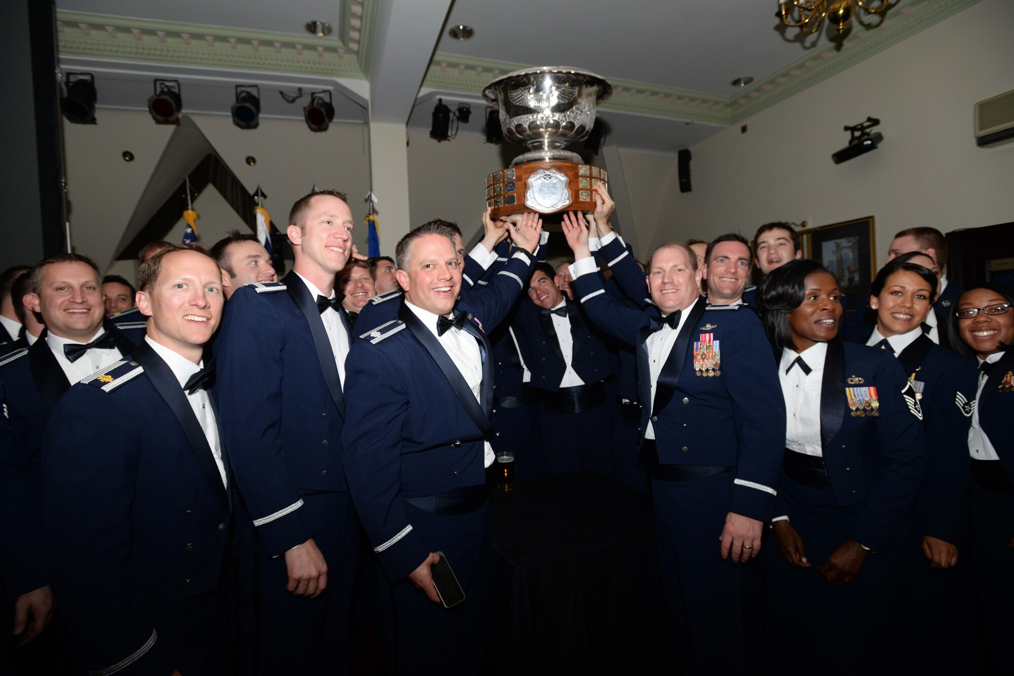 48th Fighter Wing Airmen celebrate during the 2014 Raytheon Trophy presentation May 29, 2015. The 493rd Fighter Squadron received the trophy as the U.S. Air Force's top fighter squadron. (U.S. Air Force photo by Tech. Sgt. Eric Burks/Released)