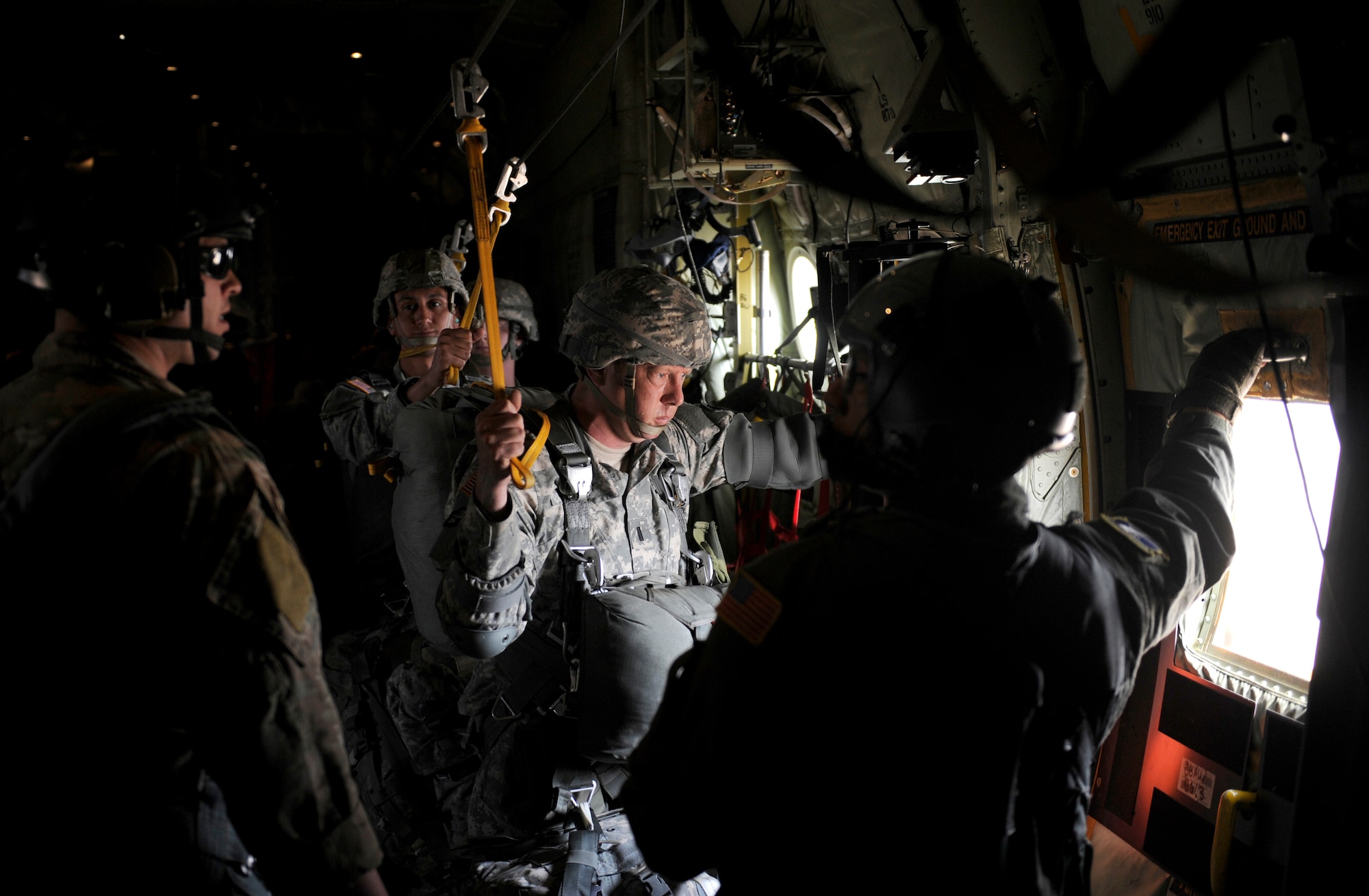 U.S. Army Soldiers from Headquarters and Headquarters Company 173rd Brigade Special Troops Battalion (Airborne) prepare for a 1,100ft. combat equipment jump during Exercise Noble Shirley 2015 May 12, 2015, over Israel. The soldiers received last minute safety instructions from U.S. Army Staff Sgt. Brandon Fountain, 435th Contingency Response Group jump master out of Ramstein Air Base, Germany. (U.S. Air Force photo/Tech. Sgt. Patrick Mitchell)


